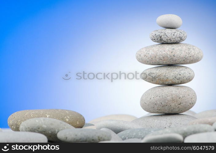 Pebbles stack against gradient background