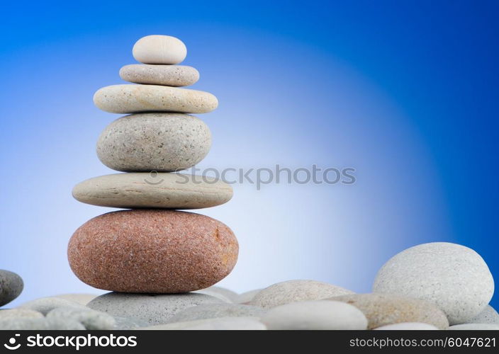 Pebbles stack against gradient background