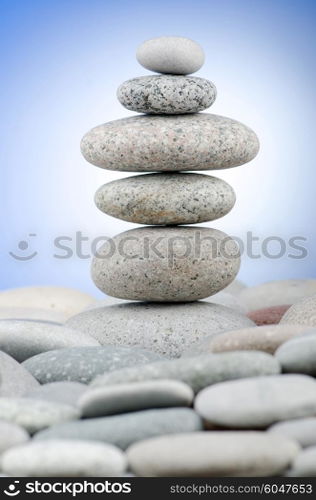 Pebbles stack against gradient background