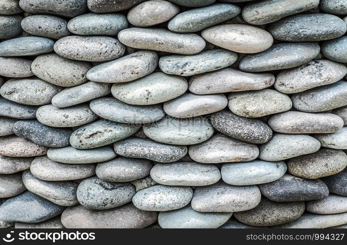 Pebbles stone wall ,texture background.