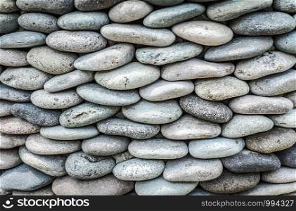 Pebbles stone wall ,texture background.