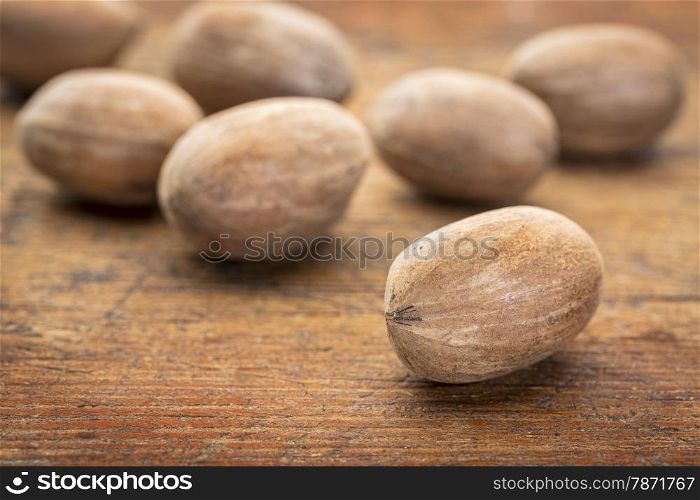 pecan nuts on a grunge wood surface with a selective focus
