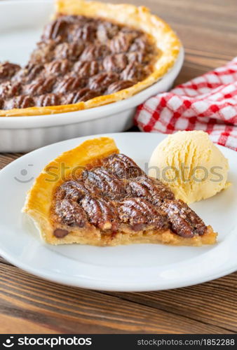 Pecan pie - traditional southern US dessert on wooden table