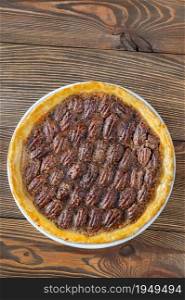 Pecan pie - traditional southern US dessert on wooden table