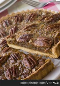 Pecan Pie With A Slice Being Cut