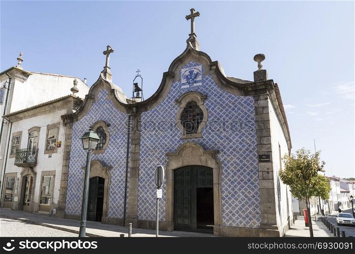 Peculiar facade of two bodies entirely covered with ttaditional Portuguese tiles of the Church of Mercy, in Braganca, Portugal