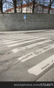 Pedestrian crossing sign on empty street; Tallinn; Estonia; Europe