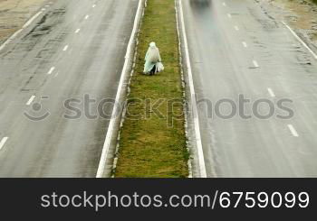 Pedestrian On Dividing Line Under The Rain