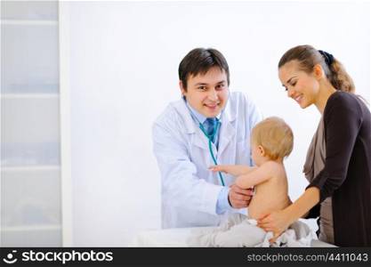 Pediatric doctor examines baby using a stethoscope &#xA;