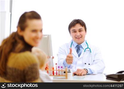 Pediatric doctor having consultation with mother with baby&#xA;