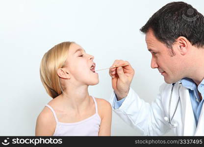 Pediatrician checking little girl throat