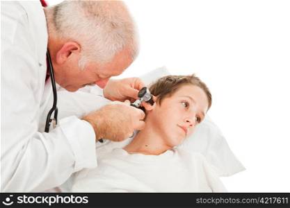 Pediatrician looking in a little boy&rsquo;s ears. Isolated on white.