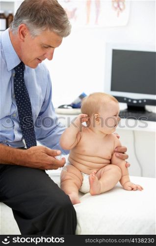 Pediatrician with baby
