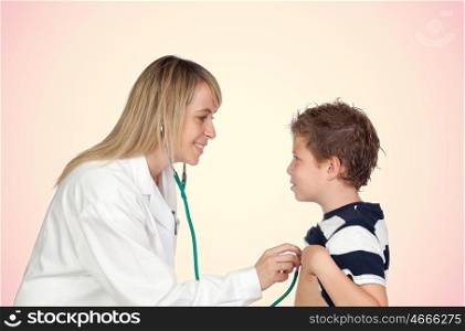 Pediatrician woman making a checkup for child isolated on orange