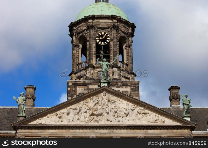 Pediment and Tower of the Royal Palace (Dutch: Koninklijk Paleis) in Amsterdam, Netherlands, 17th century classical style.