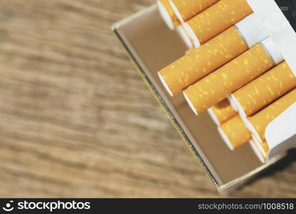 peel it off Cigarette pack prepare smoking a cigarette on the wooden. Packing line up. photo filters Natural light. soft focus. Leave space to write a description of the message.