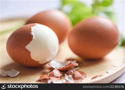 Peeled eggs menu food boiled eggs in a wooden plate decorated with leaves green vegetable and eggshell for cooking healthy eating