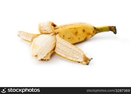 peeled fresh banana isolated on white bg