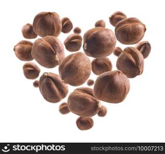 Peeled hazelnut in the shape of a heart on a white background.. Peeled hazelnut in the shape of a heart on a white background