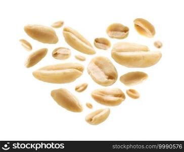 Peeled peanuts in the shape of a heart on a white background.. Peeled peanuts in the shape of a heart on a white background