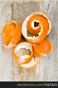 peeled ripe orange mandarin, mandarin peel lies in the form of a spiral, close-up citrus. peeled ripe orange mandarin
