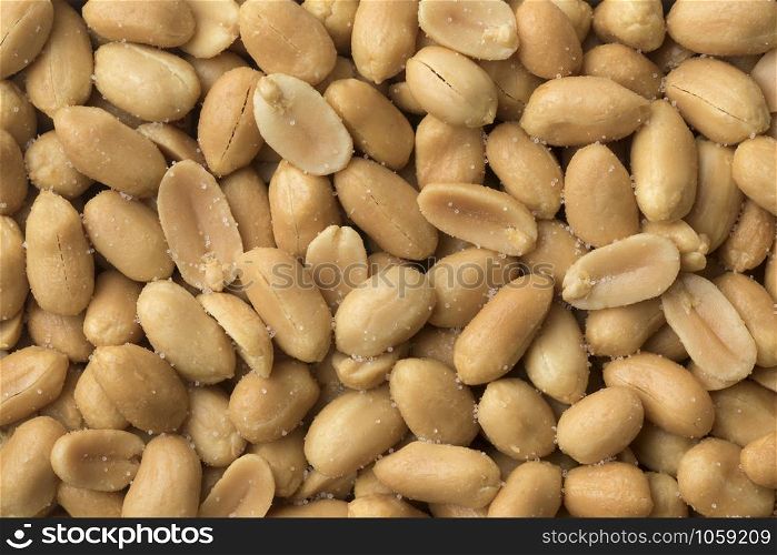 Peeled salted peanuts close up full frame