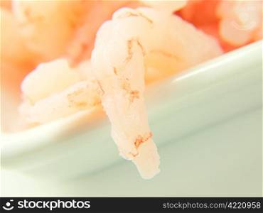 Peeled shrimps in a bowl. Peeled shrimps, isolated in a white bowl