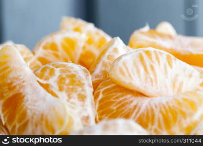Peeled tangerine while cooking food from tangerines, cooking dessert. Peeled tangerine