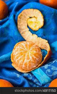 Peeled tangerine with peel , top view
