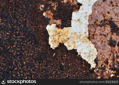Peeling paint rusty metal background. Abstract industrial iron texture.