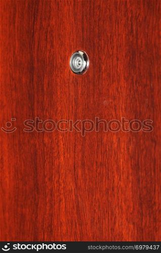 Peephole on wooden door - judas hole spyhole