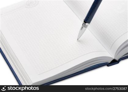 Pen above a notebook. It is isolated on a white background