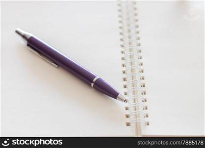 Pen and blank spiral notebook, stock photo