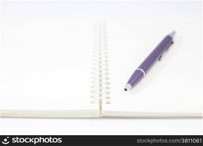 Pen and spiral notebook isolated on white background, stock photo