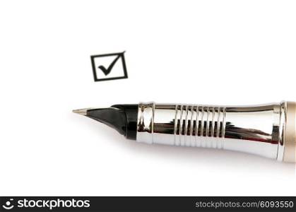 Pen and ticked tick box isolated on white
