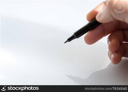 Pen in the hand isolated over white background