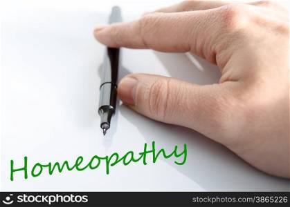 Pen in the hand isolated over white background homeopathy concept