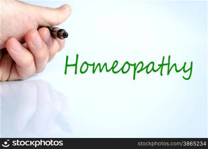 Pen in the hand isolated over white background homeopathy concept