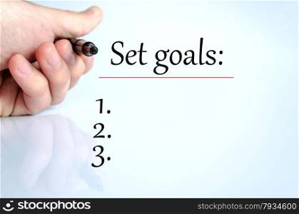 Pen in the hand isolated over white background Set Goals