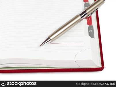 Pen on a diary isolated on a white