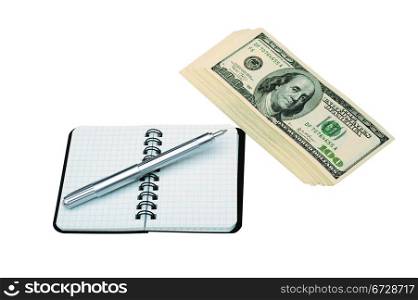 Pen On Open Blank Notebook Near Bundle Of Dollars