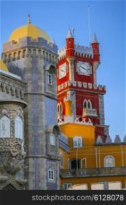 Pena castle red clock tower and blue mosaic towers in Sintra, Portugal&#xA;