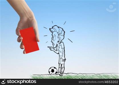 Penalty card. Caricature of football player and human hand showing red card