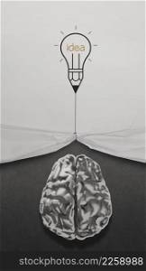 pencil lightbulb draw rope open wrinkled paper show metal brain 3d with business strategy icons as concept
