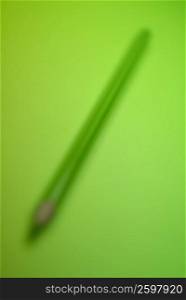 Pencil on a green background
