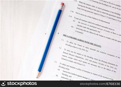 Pencil with agreement between landlord and tenant