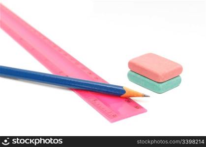 Pencils, eraser and ruler on a white background