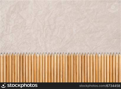 Pencils isolated, texture of paper as background