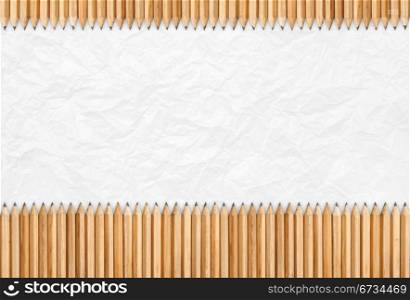 Pencils isolated, texture of paper as background