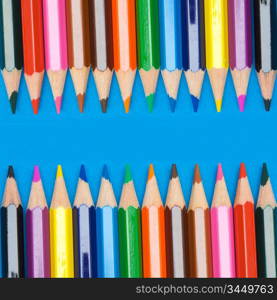 Pencils of many colors a over blue background